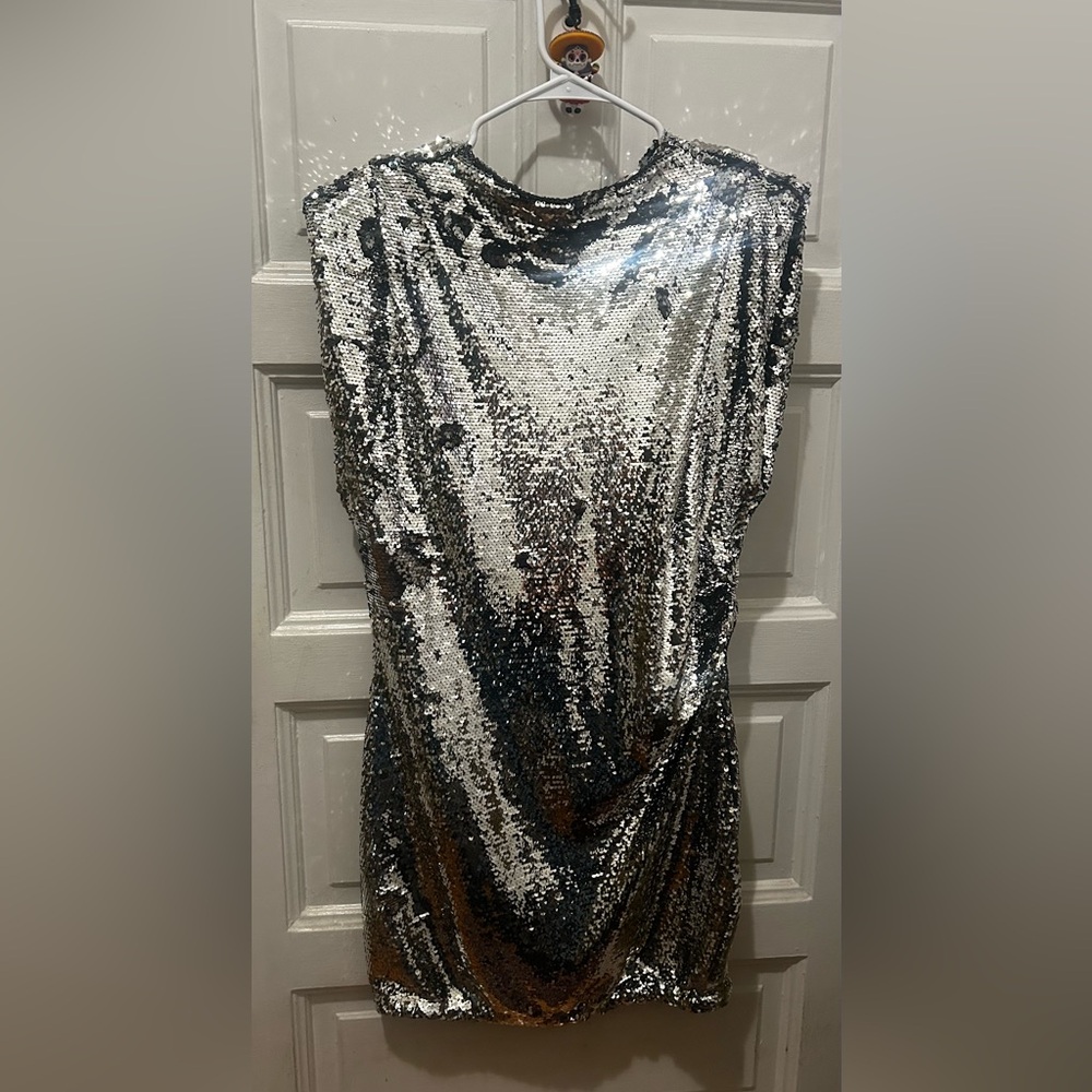 Looking for the perfect party dress? H&M Shimmering Silver Sequin mini dress.